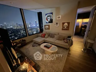 Stunning living room with panoramic city view, cozy seating, and elegant decor, perfect for urban living.