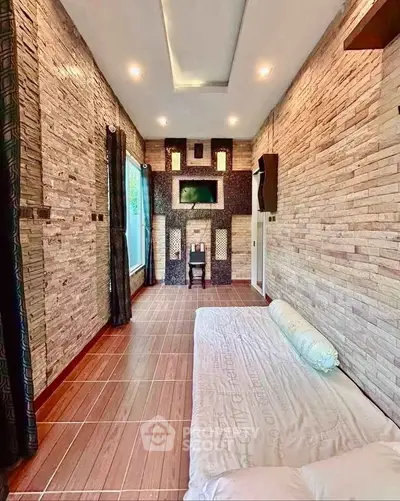 Stylish modern living room with stone accent walls and sleek flooring