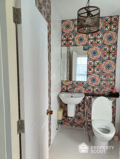 Charming bathroom with colorful tile design and modern fixtures