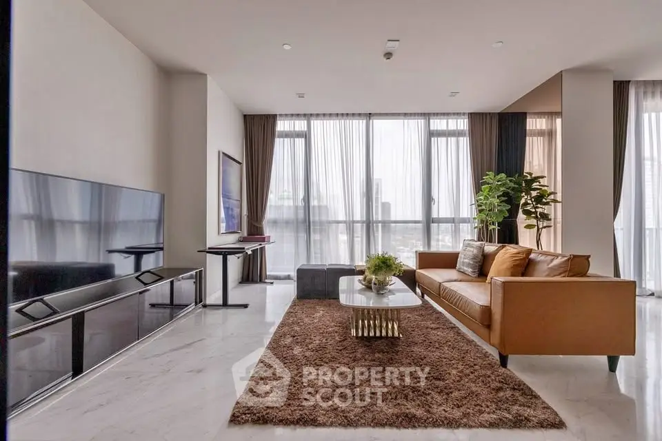 Luxurious modern living room with large windows and elegant decor