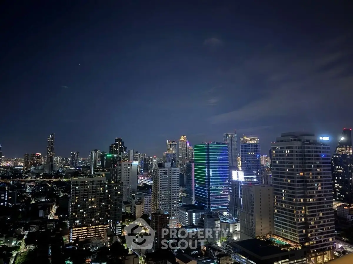 Stunning city skyline view at night with illuminated skyscrapers.