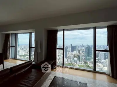 Luxurious living room with panoramic city view from high-rise windows
