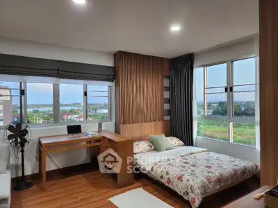 Spacious bedroom with scenic view and modern wooden decor