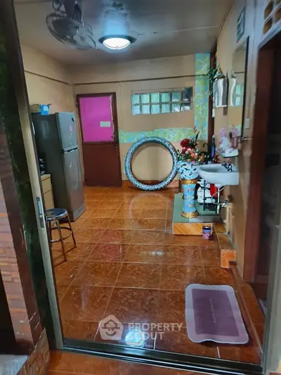 Cozy kitchen area with tiled flooring and modern appliances