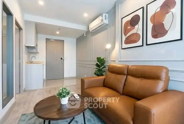 Modern living room with stylish decor and leather sofa in a contemporary apartment.