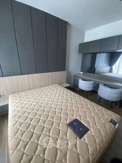 Modern bedroom with stylish decor and comfortable bed in a contemporary apartment.