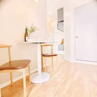Bright and modern dining area with wooden flooring and minimalist decor