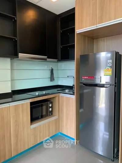 Modern kitchen with sleek cabinets and stainless steel appliances