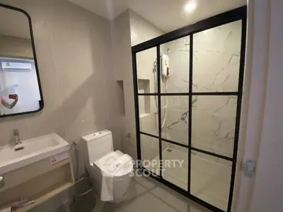 Modern bathroom with sleek shower enclosure and contemporary fixtures