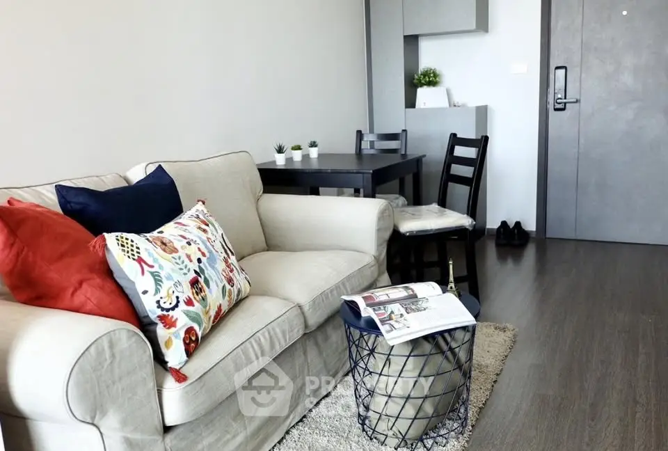 Modern living room with cozy sofa and stylish decor in a contemporary apartment.