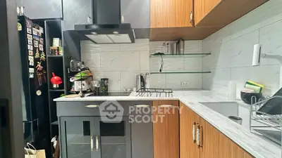 Modern kitchen with sleek cabinets and marble countertops