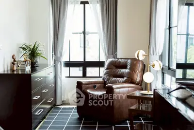 Cozy living room with leather armchair and modern decor