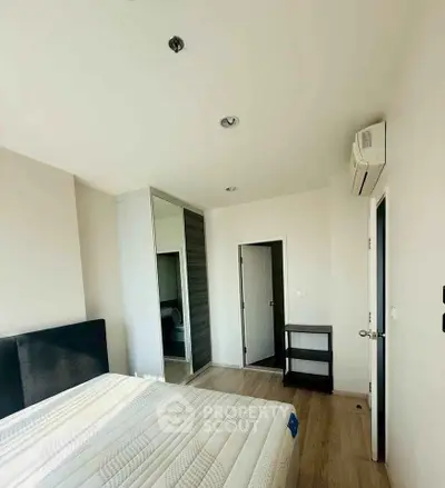 Bright and airy bedroom with modern furnishings and ample natural light