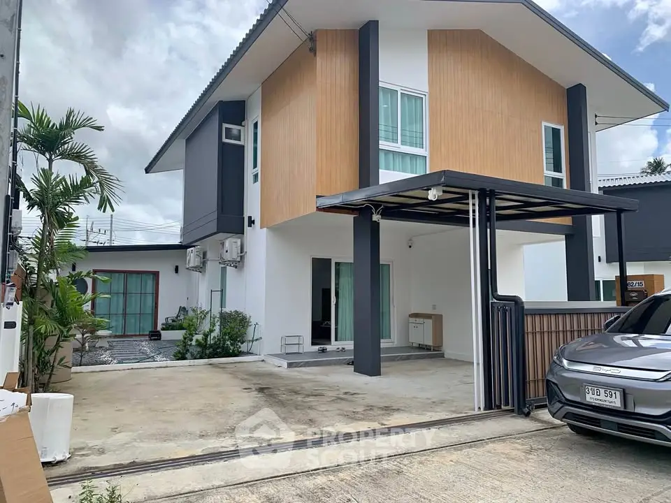 Modern two-story house with carport and stylish facade