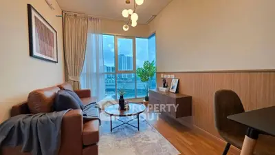 Stylish living room with modern decor and large window offering city view