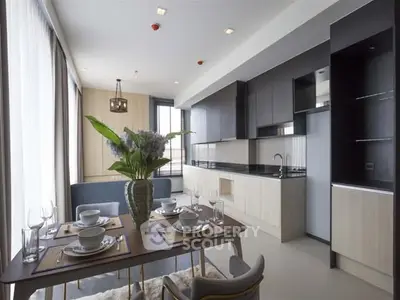 Modern open-layout kitchen with dining area and sleek cabinetry