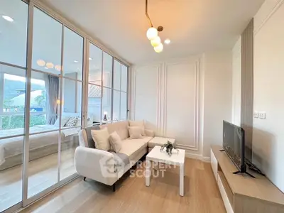 Modern living room with glass partition and cozy decor