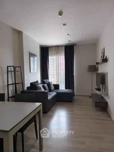 Modern living room with sleek furniture and natural light, perfect for urban living.