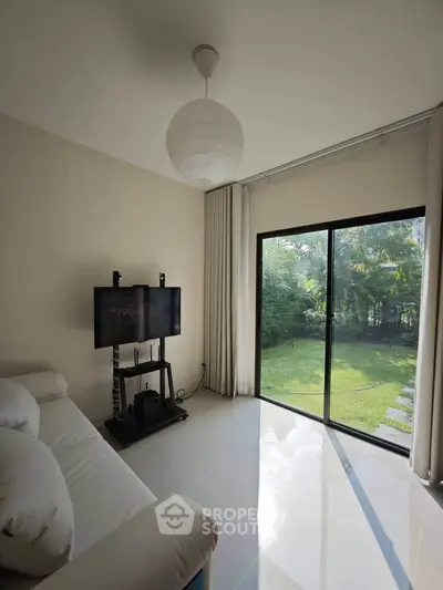 Bright living room with garden view and modern decor