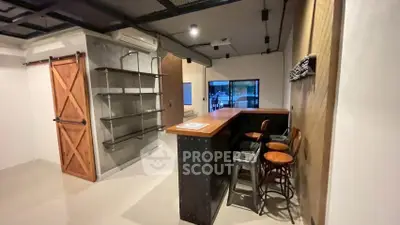 Stylish modern kitchen with open layout and rustic bar seating