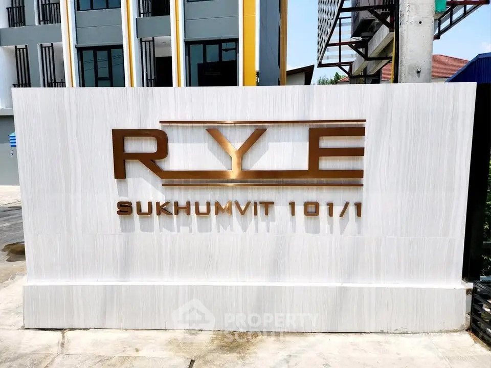 Modern real estate development sign at Rye Sukhumvit 101/1 entrance
