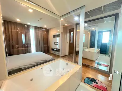 Luxurious bedroom with ensuite jacuzzi and modern decor