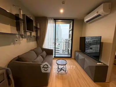 Modern living room with city view, sleek furniture, and air conditioning.