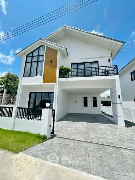 Modern two-story house with spacious driveway and sleek design