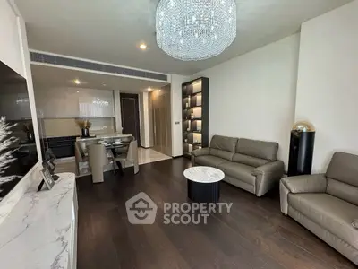 Luxurious living room with elegant chandelier and modern furniture