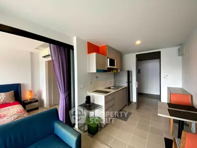 Modern studio apartment with open kitchen and cozy living area