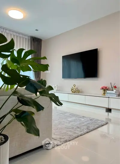 Modern living room with sleek TV setup and elegant decor