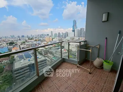Spacious balcony with stunning city skyline view, perfect for relaxation and enjoying urban living.