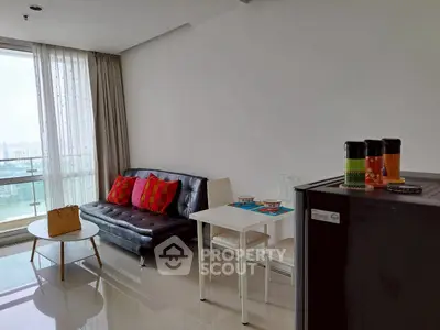 Modern living room with sleek furniture and city view, perfect for urban living.