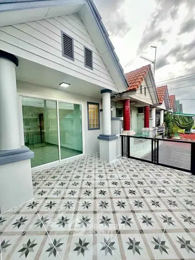Charming townhouse with spacious balcony and stylish tile flooring, perfect for modern living.