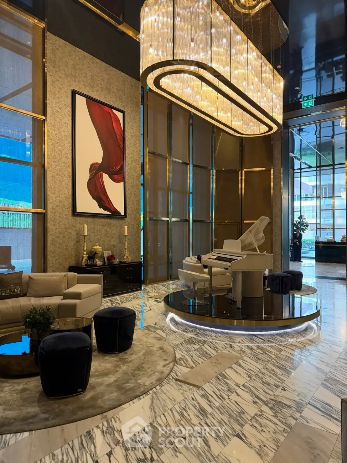 Luxurious building lobby with elegant chandelier and modern decor