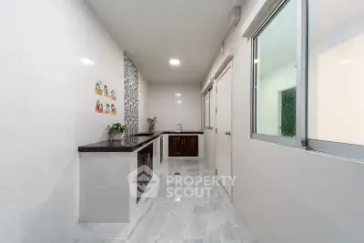 Modern kitchen with sleek countertops and ample natural light