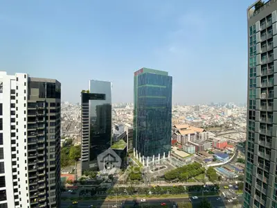 Stunning cityscape view from high-rise building showcasing modern architecture and vibrant urban life.