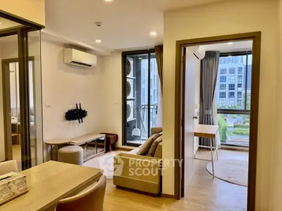 Modern apartment interior with open living space and balcony view