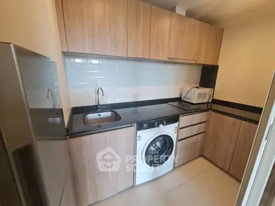 Modern kitchen with wooden cabinets and built-in appliances