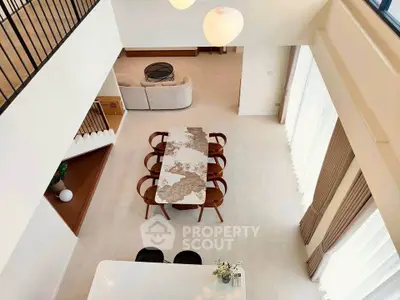 Stunning open-plan living area with elegant dining setup and modern decor