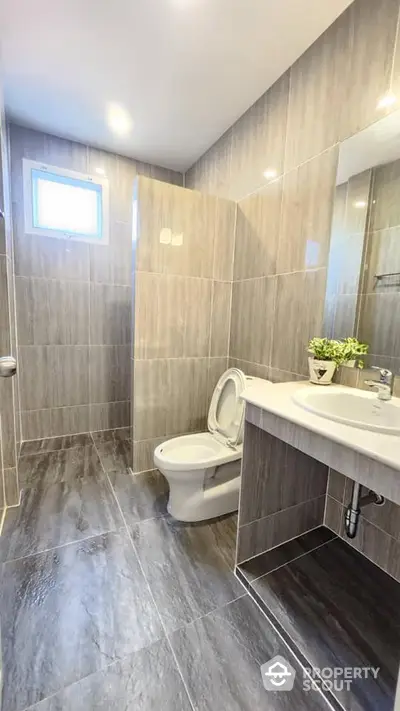 Modern bathroom with sleek gray tiles and stylish fixtures