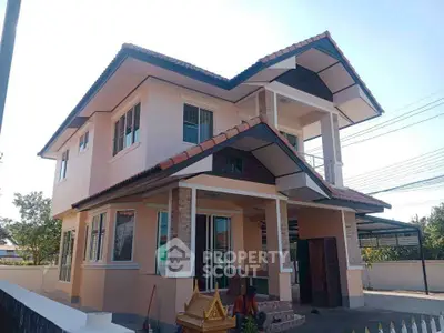 Charming two-story house with modern architecture and spacious outdoor area.