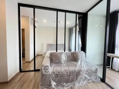Modern apartment with glass partition and cozy living area