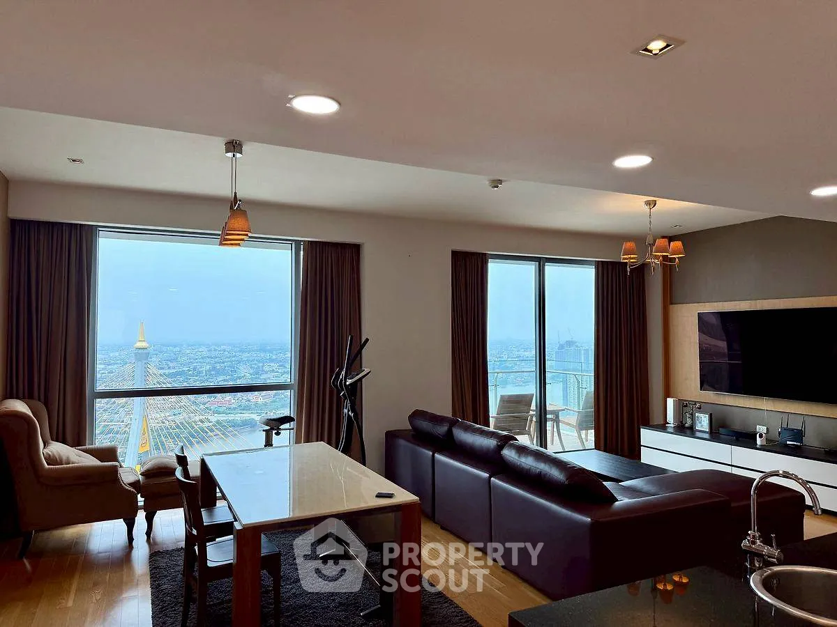 Luxurious living room with stunning city view and modern furnishings.