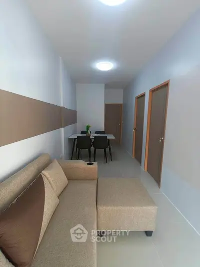 Modern living room with sleek furniture and minimalist design, perfect for contemporary urban living.