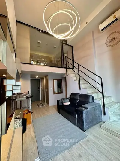 Modern loft apartment with stylish interior and spiral staircase