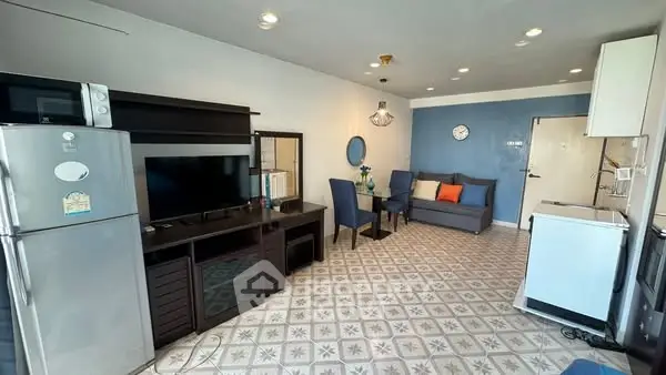 Modern living room with stylish furniture and appliances, featuring a cozy seating area and elegant decor.