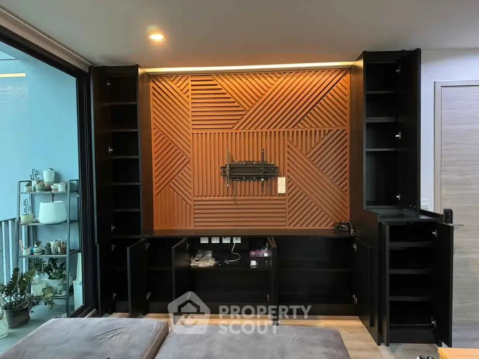 Modern living room with stylish wooden paneling and open shelving