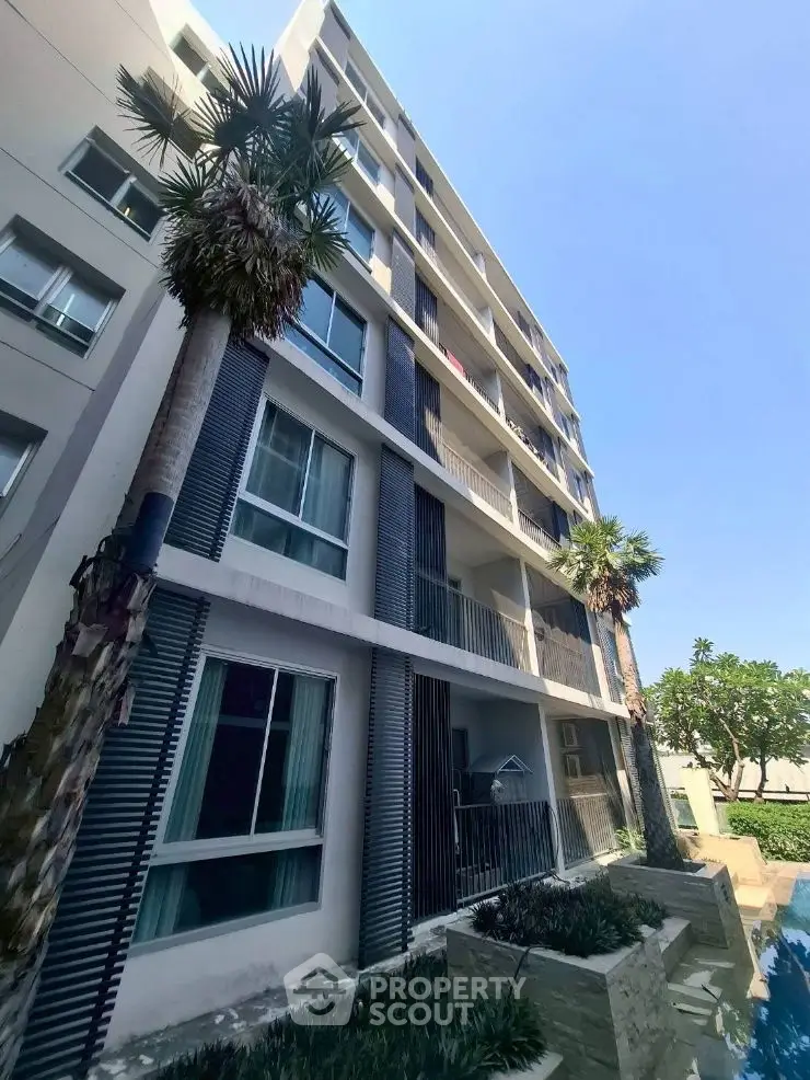 Modern architectural building with sleek design and lush greenery