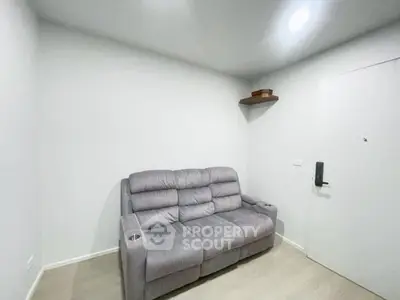 Cozy small living room with a plush gray sofa and modern decor